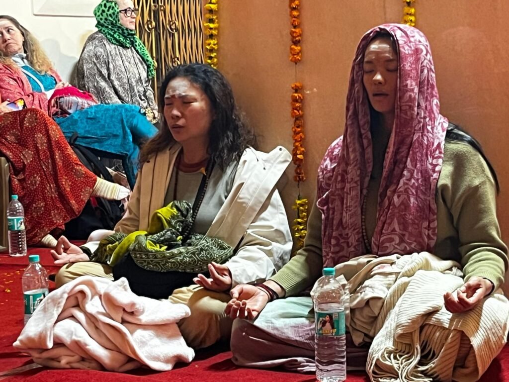 Chanting at the all-night Shivratri celebration during the 2026 14-day spiritual yoga retreat of an Australian group